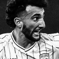 Black and white image of Omar Yehya playing in a soccer match